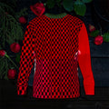 Image 1 (front, flat lay on dark wood): Vol IV — The Declaration Sweatshirt — front flat lay, scarlet red & black checkered body with solid scarlet red long sleeves and green ribbed collar, rose and greenery editorial backdrop on dark wood — Golden Expression Art