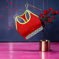 Image 1 Alt Text: Vol IV — The Golden Bra, front view, Doll Wall and family print all-over body — Golden Expression Art Limited Edition
