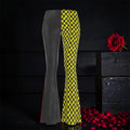 Image 1 (side view, yellow/black checkered + slate grey): Vol IV — The Golden Gambit Flare Pants — side view, split-panel flare silhouette with golden yellow & black checkered right leg and slate grey left leg with scarlet red side seam detail, rose petal dark editorial backdrop — Golden Expression Art