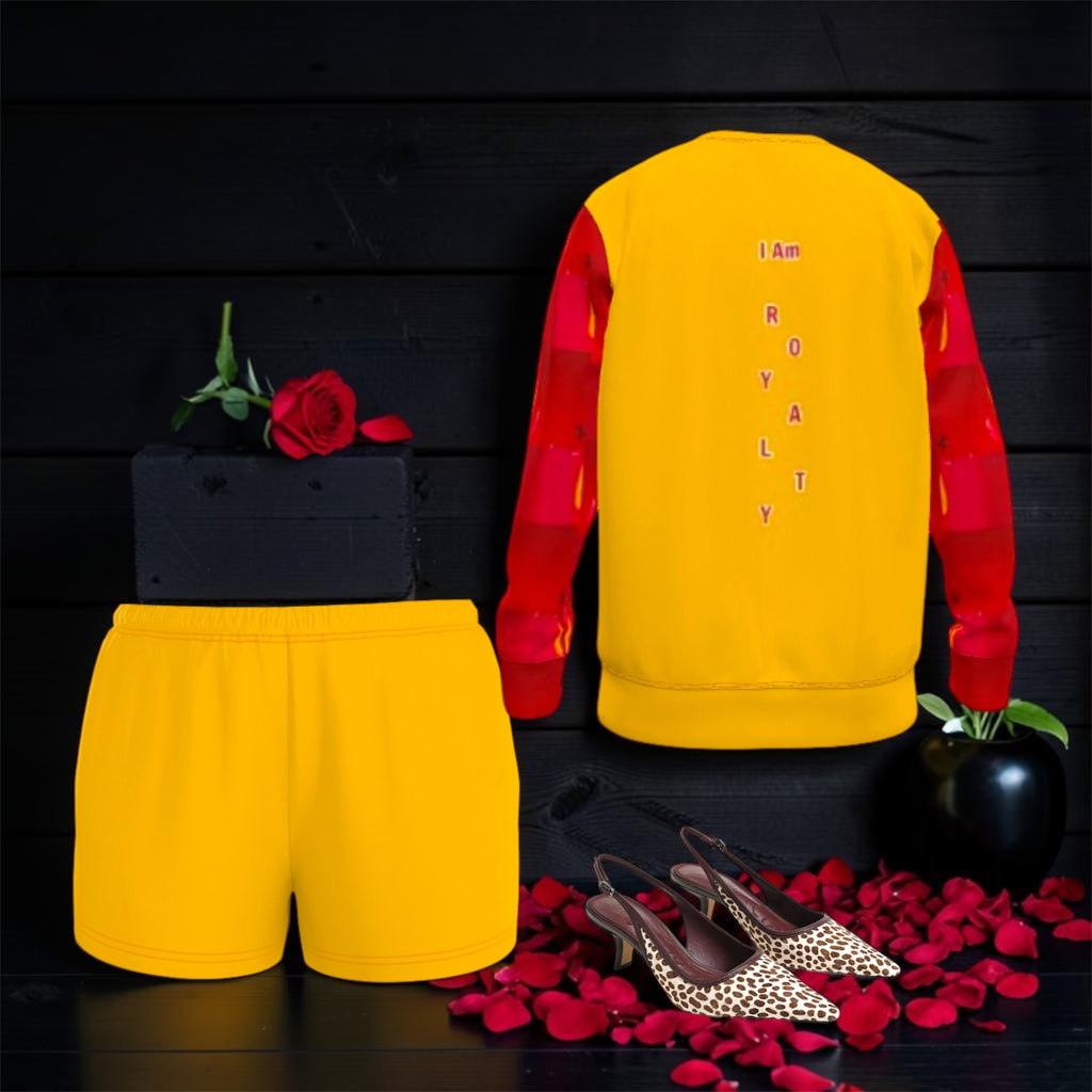 Image 2 (back view styled with matching golden shorts, rose petals, heels — flat lay editorial): Golden Expression Art Vol IV The I Am Royalty Sweatshirt — Back Editorial Styling Shot — Styled with Golden Shorts and Heels — Stay Golden Edit
