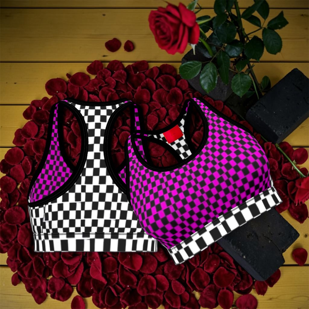 Image 2 (both colorways styled together): Vol IV — The Magenta Checkmate Bra Top — magenta and black checkered bra top styled alongside black and white checkered colorway, racerback silhouette, rose petal flat lay, Stay Golden Edit

