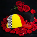 Image 1: Vol IV The Off Duty Crown cap - red yellow checkered cap front angle on rose petals

