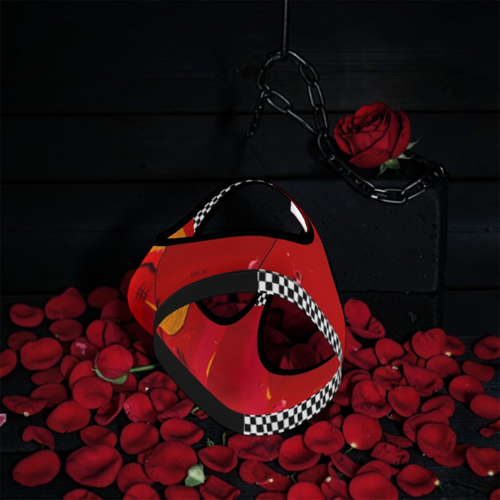 Image 3 (angled, resting on rose petals, dark backdrop): Vol IV — The Queen Dolly Sports Bra — angled view resting on rose petals, scarlet red body with Doll Wall golden hair art print, black & white checkered underband and strap detail, black trim, dark editorial backdrop — Golden Expression Art