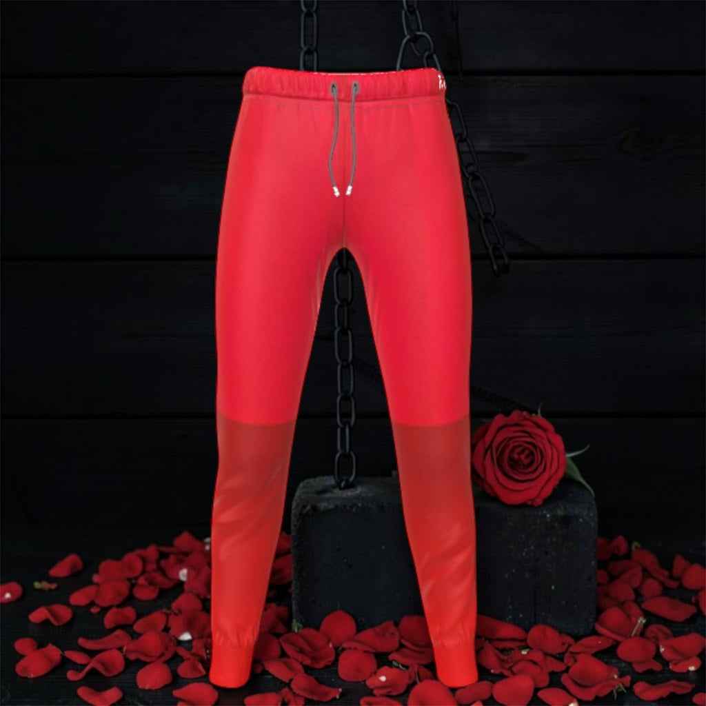 Image 1 (front, suspended on chain, dark backdrop): Vol IV — The Scarlet Reign Jogger — front view suspended on chain, solid scarlet red slim jogger with tonal mesh knee panel, elastic drawstring waistband with GEA logo tab, rose petal dark editorial backdrop — Golden Expression Art