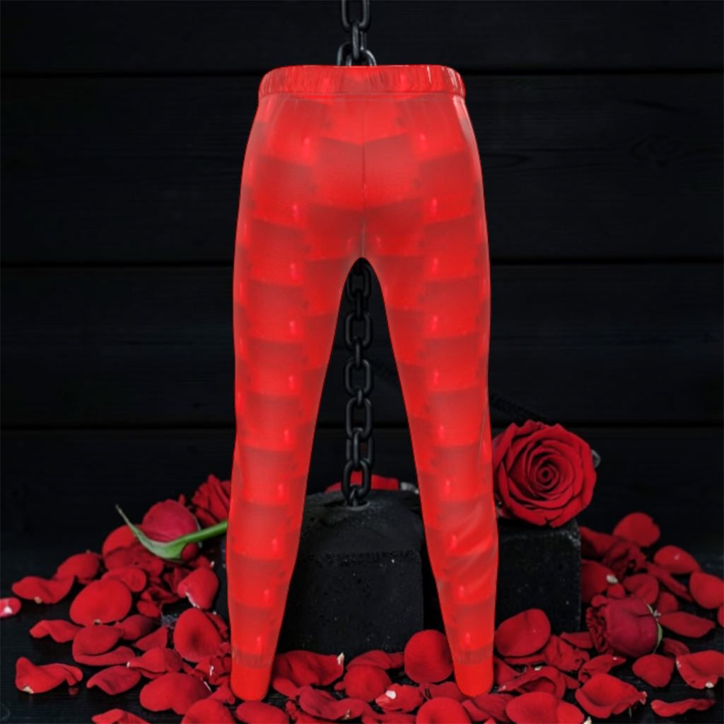 Image 2 (back, suspended on chain, dark backdrop): Vol IV — The Scarlet Reign Jogger — back view suspended on chain, scarlet red & dark red horizontal stripe body, slim tapered silhouette, elastic waistband, rose petal dark editorial backdrop — Golden Expression Art 