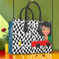 Vol I — The Isis Tote — Checkmate print front with Isis figure, black handles, gold hardware