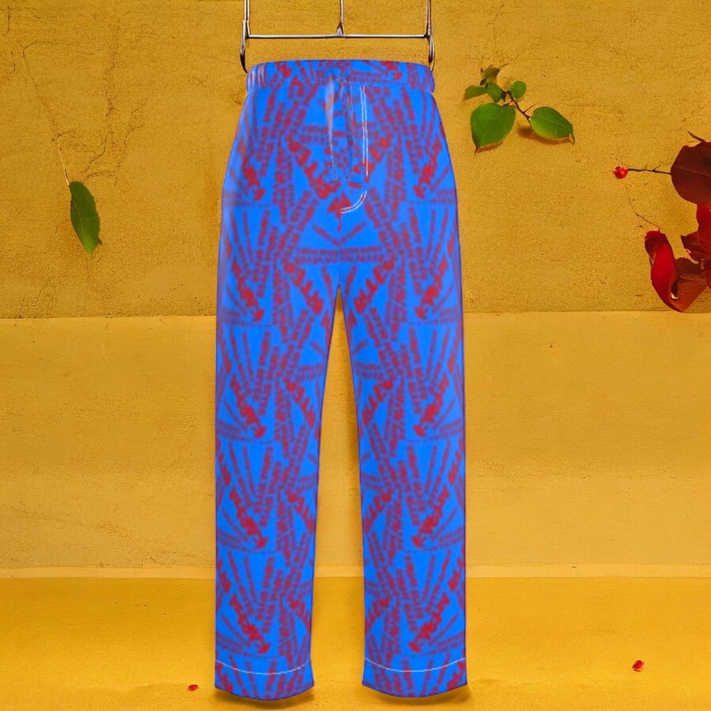 The Unbothered Silk Wide Leg Pant — cerulean blue 100% silk wide leg pant with all-over mirrored scarlet red Karma Bites print, high-waisted elastic waistband, front view on golden yellow backdrop