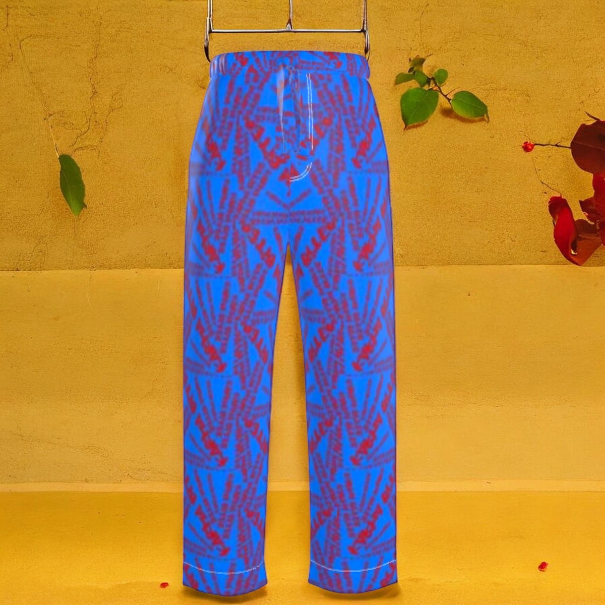 The Unbothered Silk Wide Leg Pant — cerulean blue 100% silk wide leg pant with all-over mirrored scarlet red Karma Bites print, high-waisted elastic waistband, front view on golden yellow backdrop
