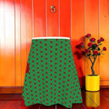 Aphrodite Flare Midi Skirt — emerald green with crimson dot print, front view, Vol II The Eden Edit