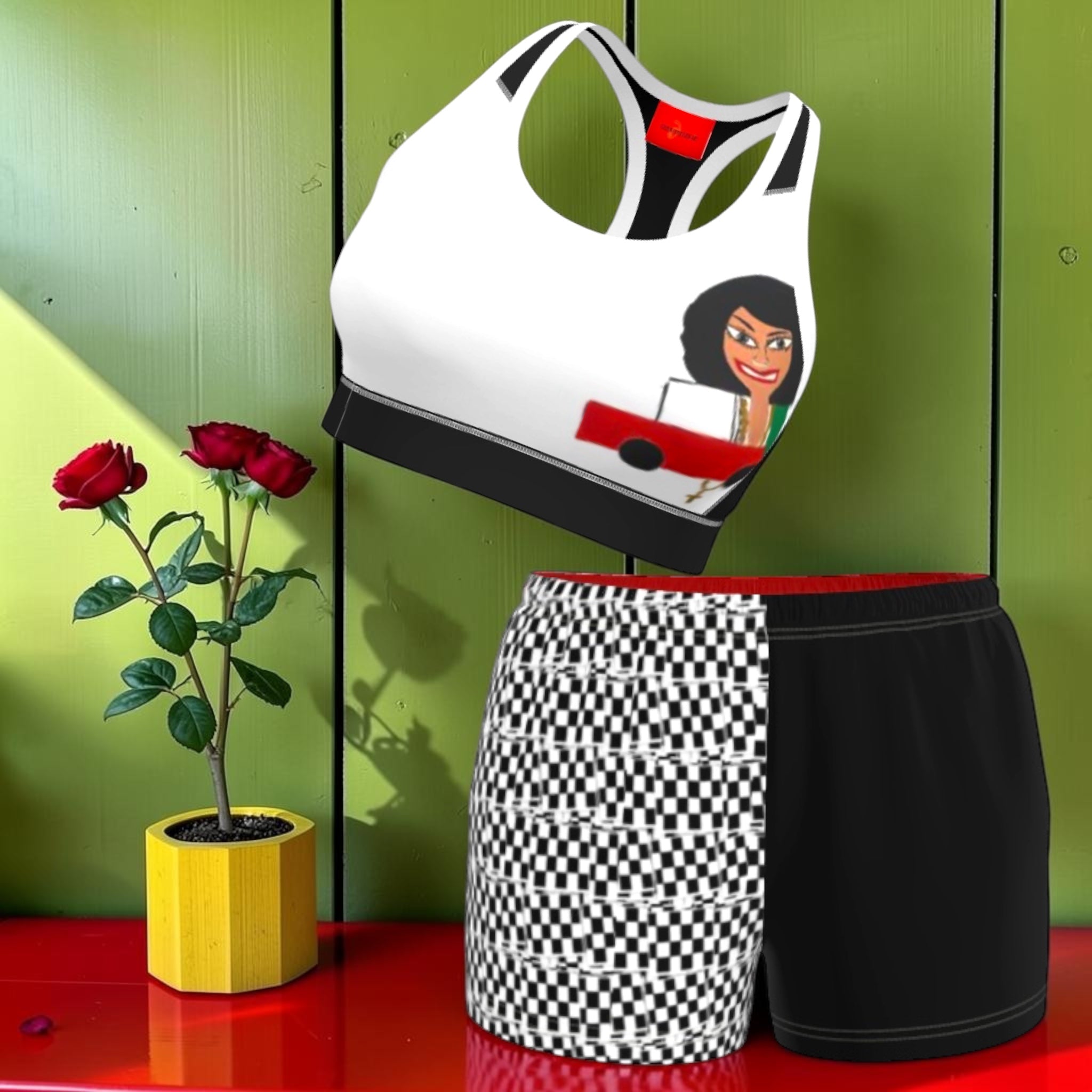 Anchored Iconic Athletic Shorts - styled set shot with matching ICONIC sports bra, checkered and black split shorts with rose petal backdrop