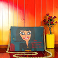 Vol II The Eden Secret Clutch — back view, Doll Wall figure on teal body with signature quote The garden holds its secrets So does she, GEA Vol II