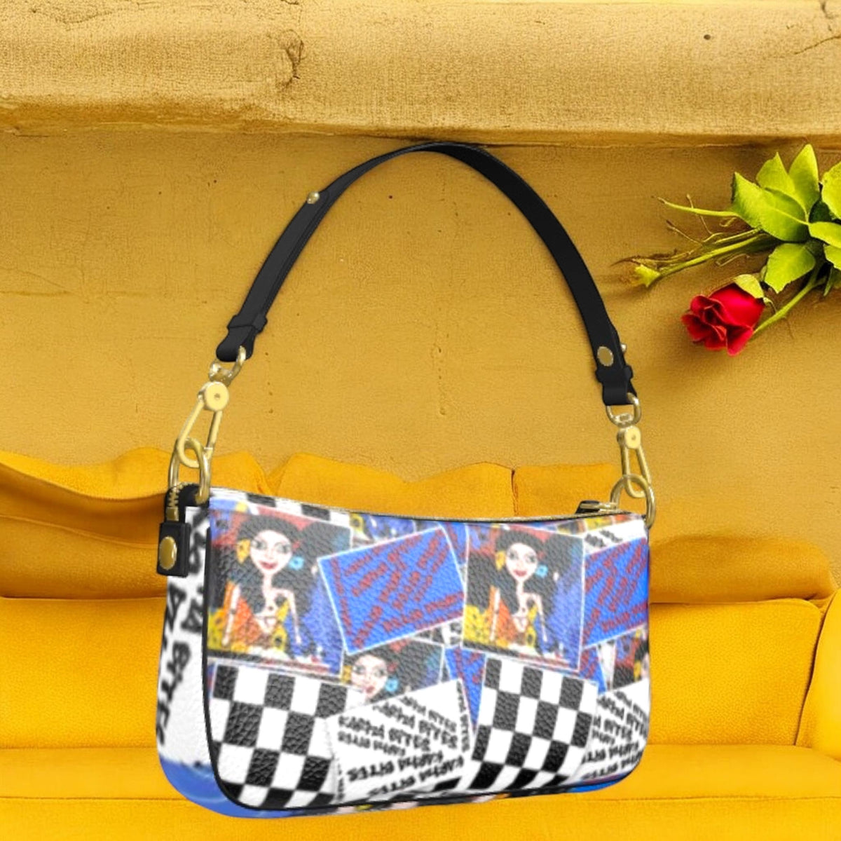 Front view of The Plot Twist Baguette Bag with Checkmate blocks, illustrated portraits, graphic text, and a slim black shoulder strap