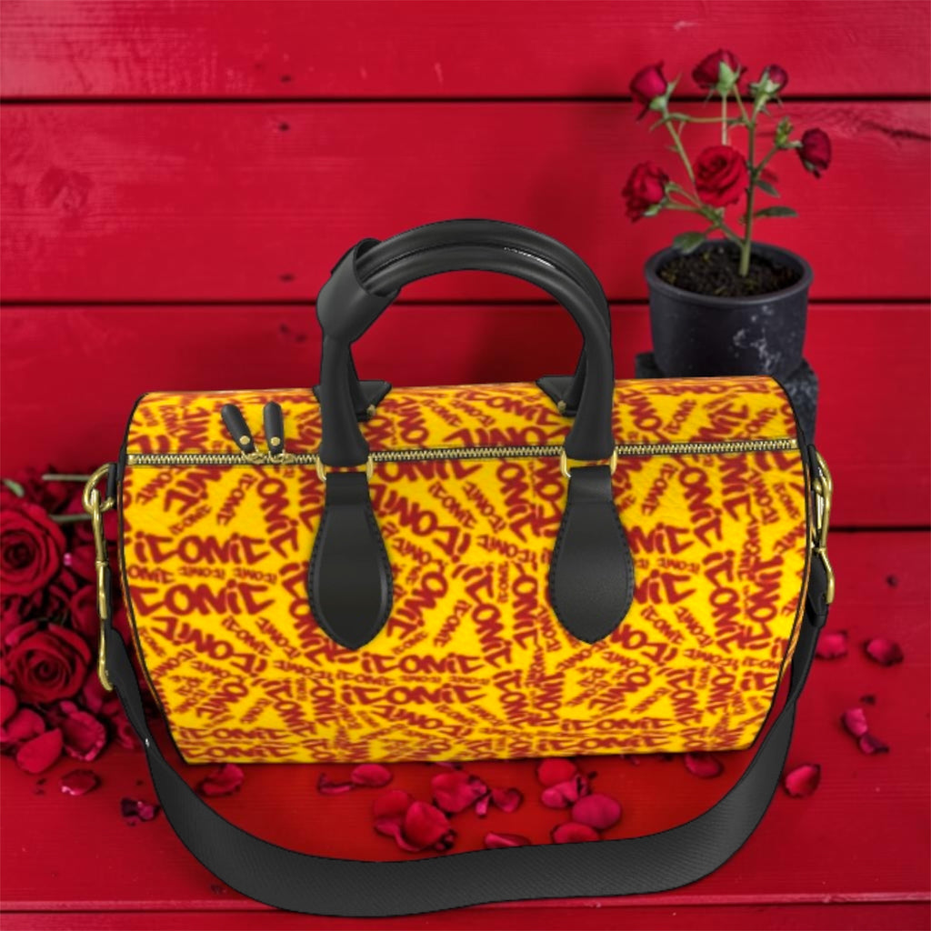 The ICONIC Carry Duffel — top view showing zip closure and dual handles, ICONIC print detail, rose petal styling
