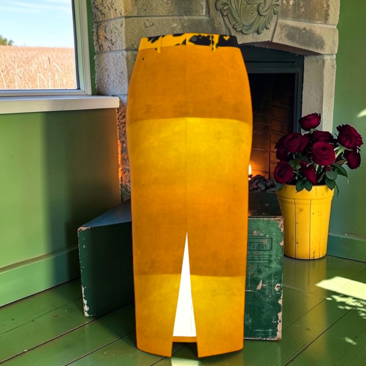 The Amber Glow Denim Maxi Skirt with amber and golden tonal panels, leopard-print waistband and center slit.