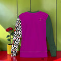 The Magenta Rule Sweatshirt — front angle, magenta body with slate grey collar and Checkmate DNA print sleeve