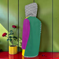 Vol I — The Golden Reign Jacket, back view showing teal body and purple sleeve
