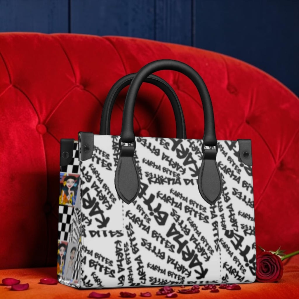 Vol III Karma Bites Satchel Tote — all-over Karma Bites graffiti print front, Checkmate DNA side panel, black leather handles and hardware — Golden Expression Art