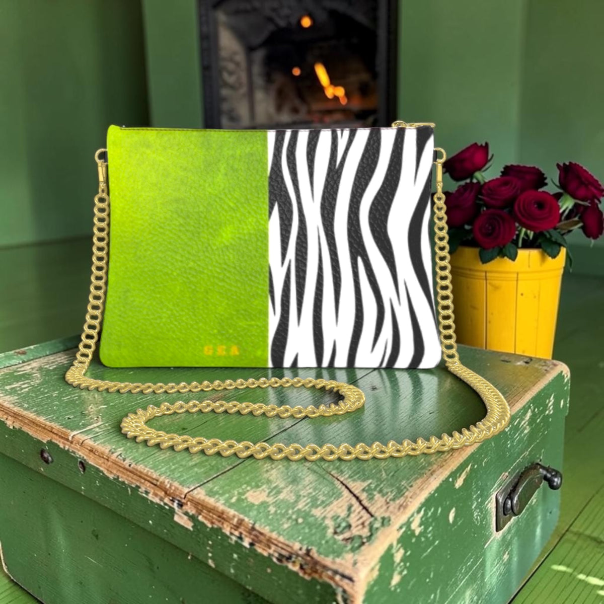 The Iconic Voltage Chain Bag with lime-green and black-and-white zebra panels, golden GEA detail and gold-tone chain strap.