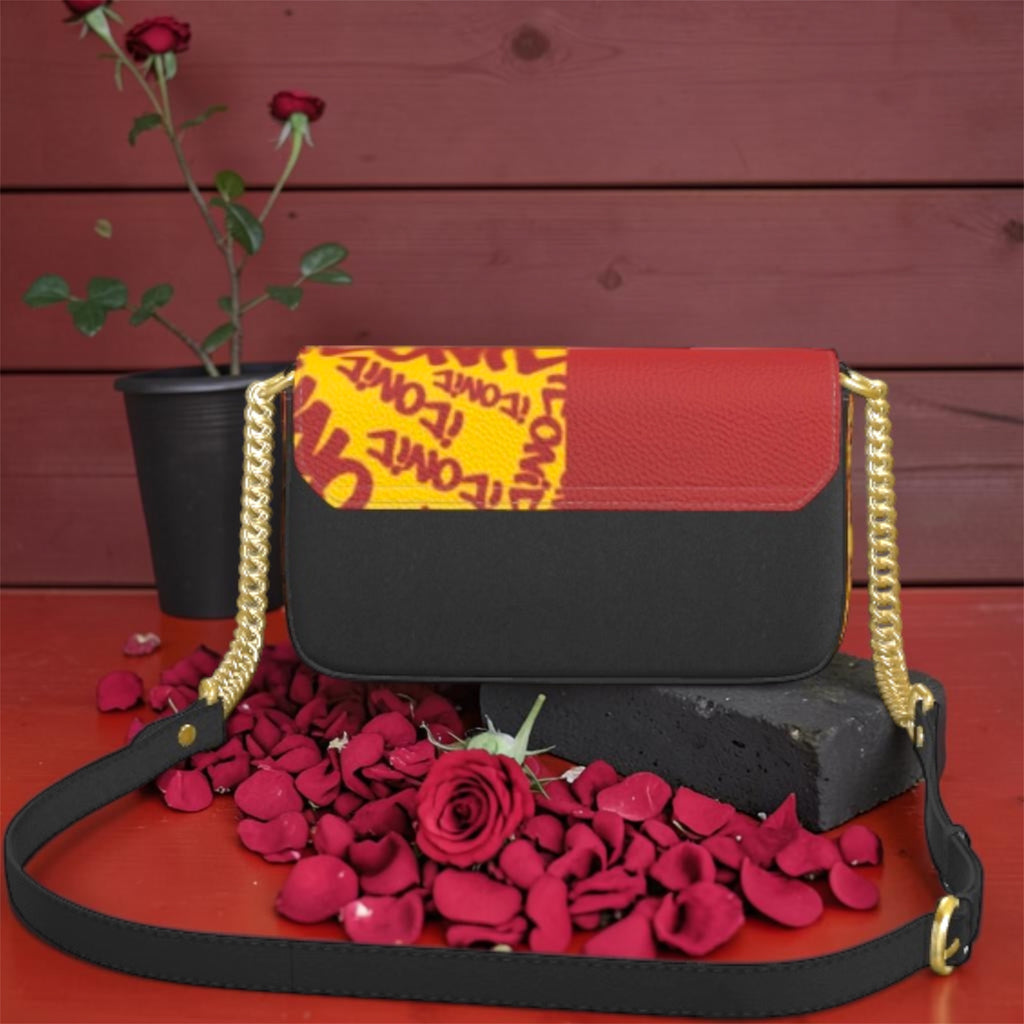 Vol IV — The ICONIC Edge Crossbody — Black/ICONIC colorway, matte black body with ICONIC print flap and gold chain hardware