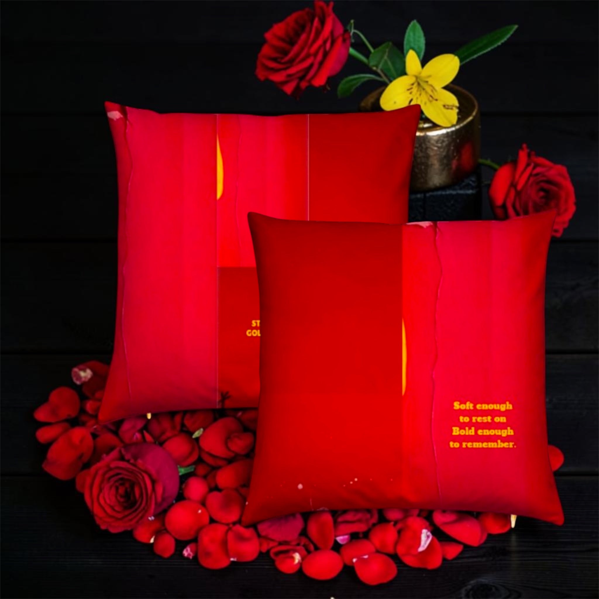 The Scarlet Throne pillow set with rose petals editorial shot