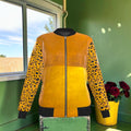 Double Instinct Reversible Silk Bomber front, amber and marigold color-block with leopard print sleeves