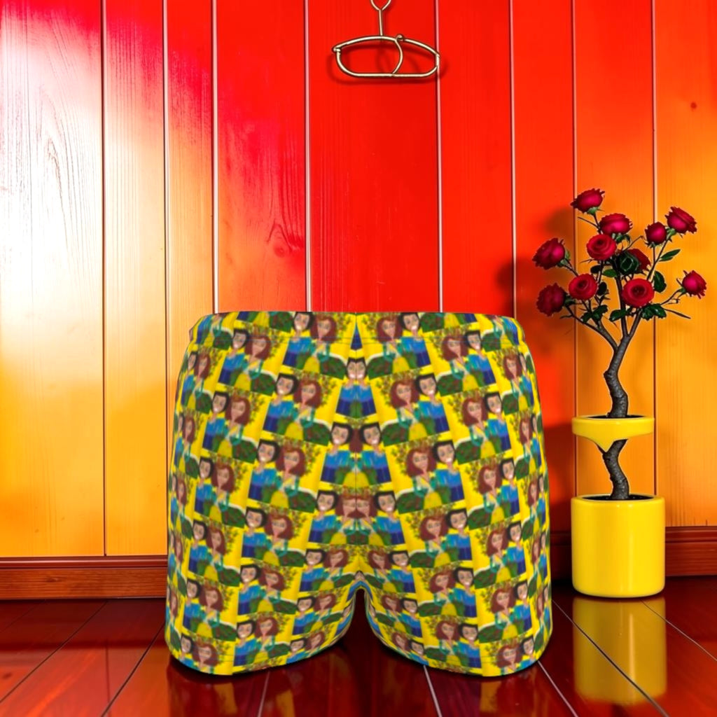 Vol II — The Sacred Garden Short, back view, all-over Eden art print, Doll Wall muse repeating pattern, golden yellow base with blue and green tones, red editorial backdrop, Golden Expression Art