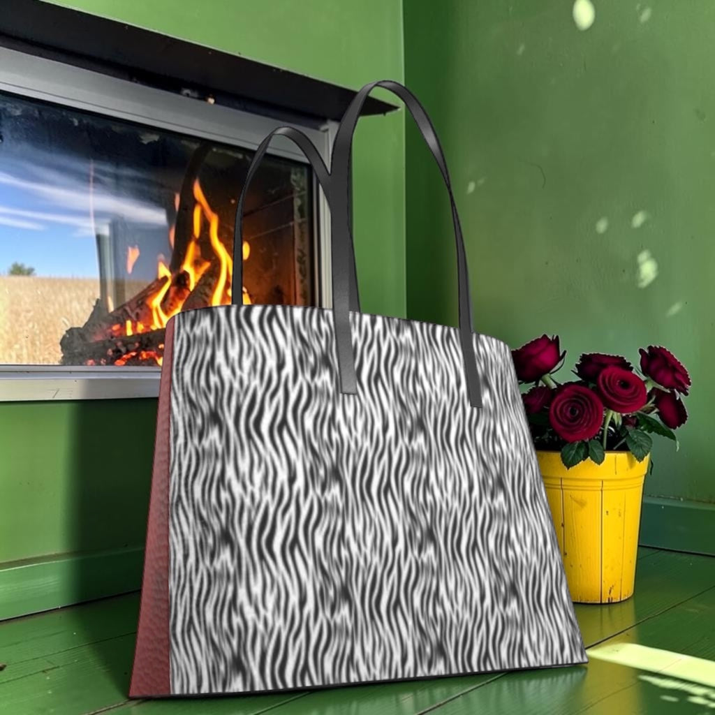 The Scarlet Instinct Large Tote with black-and-white zebra-print panel and long black handles.