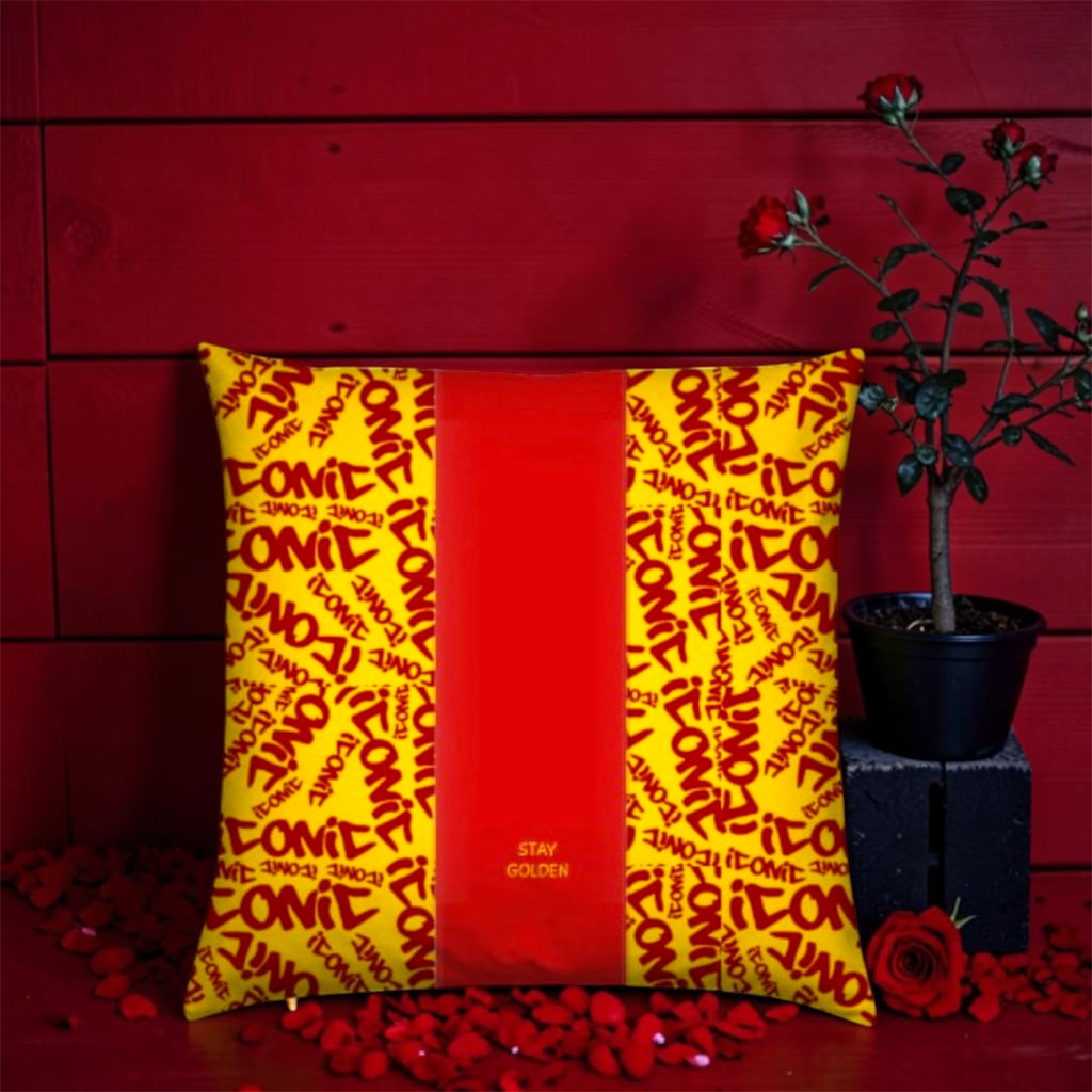 Vol IV — The ICONIC Cushion — Front view, scarlet red center panel with Stay Golden gold detail, flanked by all-over ICONIC print on golden yellow
