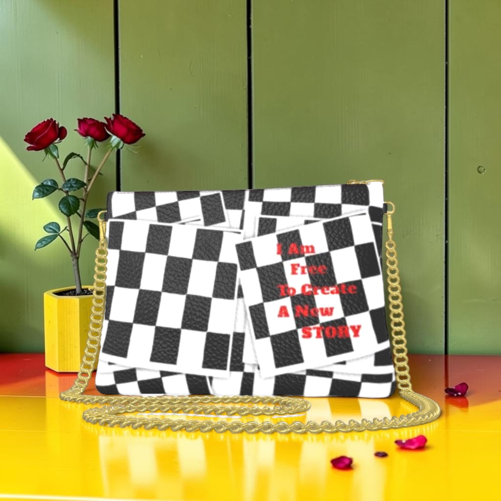Iconic Signature Clutch Bag - back view, black and white checkered print with I Am Free To Create A New Story red text, gold chain strap