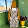 Crimson Temper Hoodie Dress front with floral print, golden tiger-stripe sleeves, and patterned hood lining