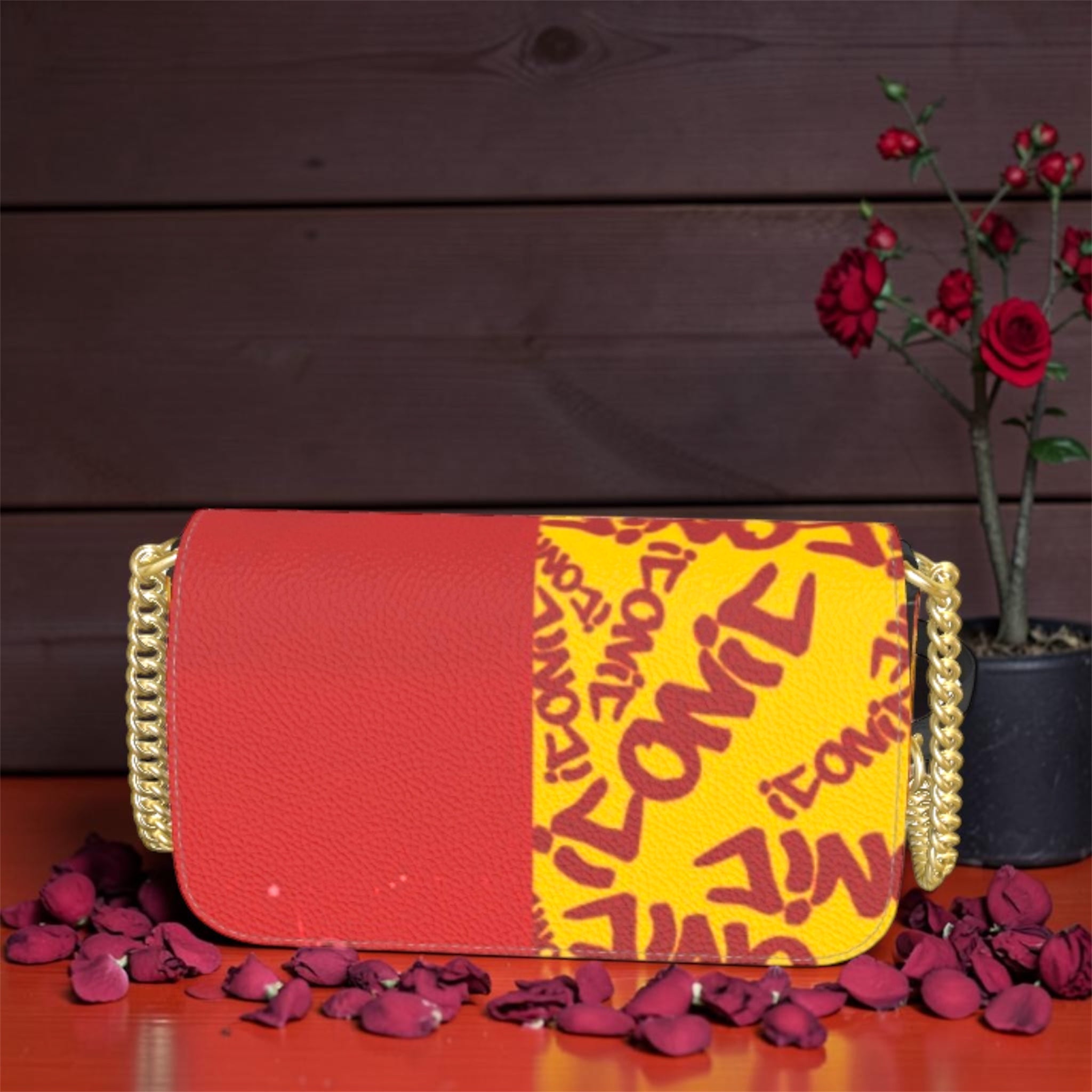Vol IV — The ICONIC Edge Crossbody — Golden/Scarlet colorway, all-over ICONIC print on golden yellow with scarlet red split panel and gold chain hardware