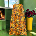 Wild Instinct silk midi skirt showing golden tiger-stripe panel