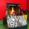 The Muse After Hours Shoulder Bag front with floral print, red-accented fashion figure, zebra stripes, black strap and gold-tone hardware