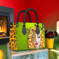 Wild Gaze mini satchel front with green portrait panel and leopard-print side