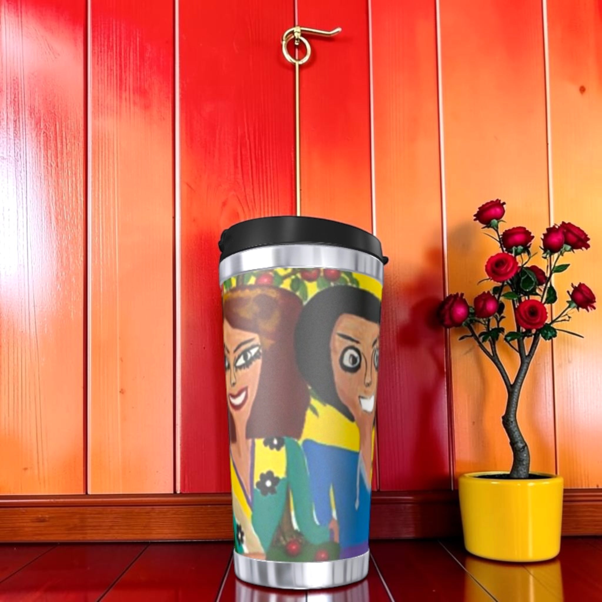 The No Ordinary Sip Travel Tumbler — Doll Wall figures close-up, two iconic characters, red wall backdrop