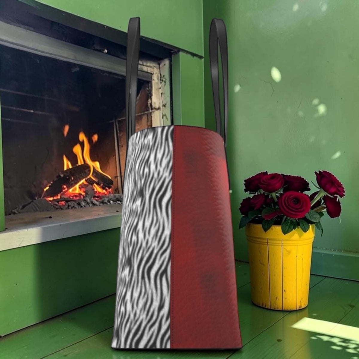 Side view of The Scarlet Instinct Large Tote showing zebra-print and red panels.