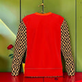The Maverick Sweatshirt back — scarlet red Nero Ponte body with Checkmate DNA tan & black check sleeves, orange collar trim — Golden Expression Art Vol I