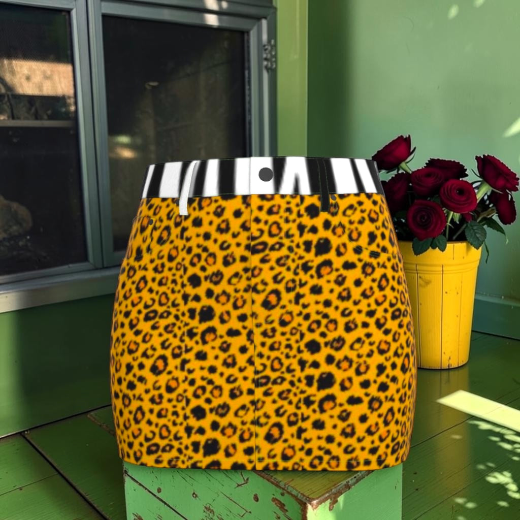Front of denim mini skirt with golden leopard print and black-and-white striped waistband