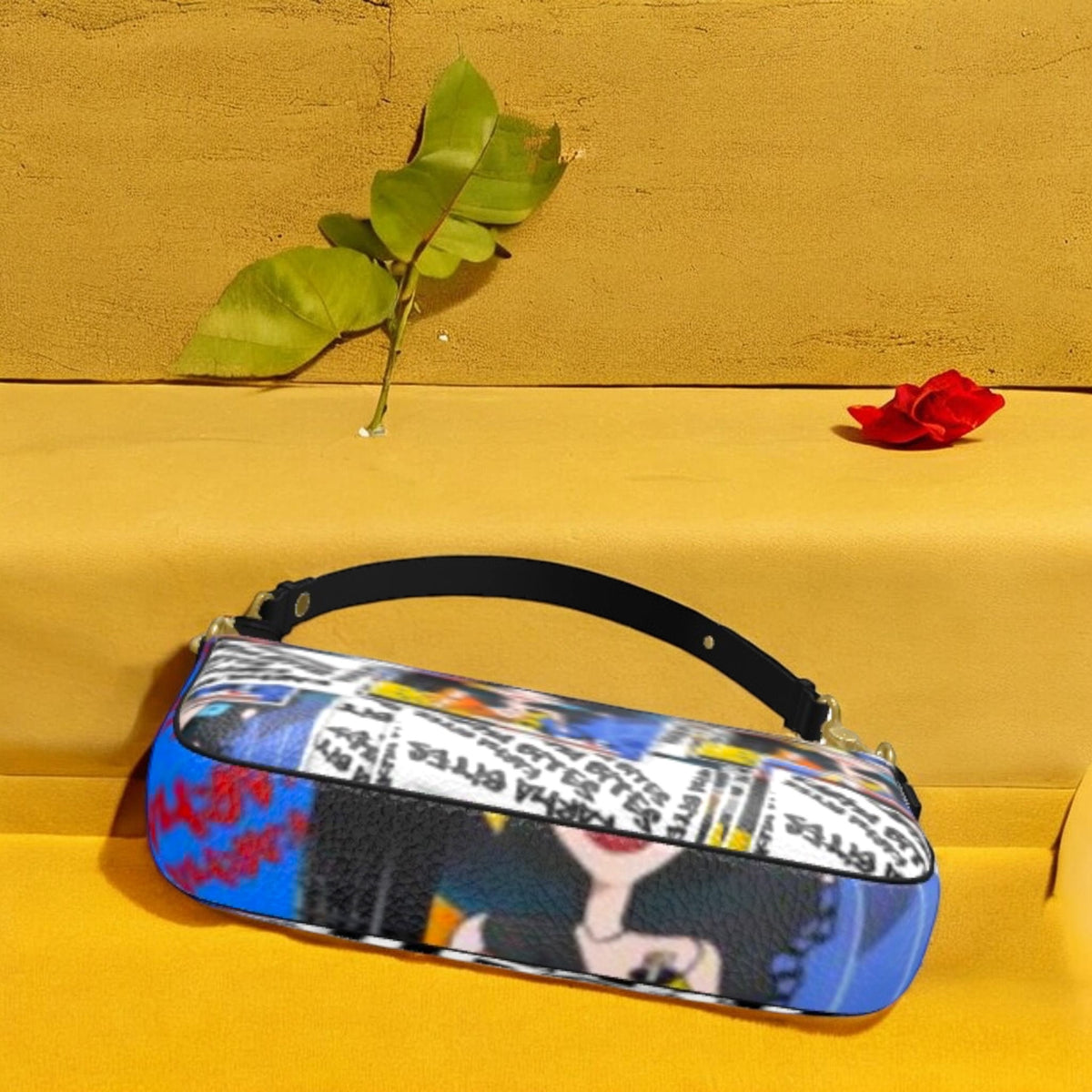 Reverse angled view of The Plot Twist Baguette Bag showing colorful collage panels, black trim, and silver-tone hardware