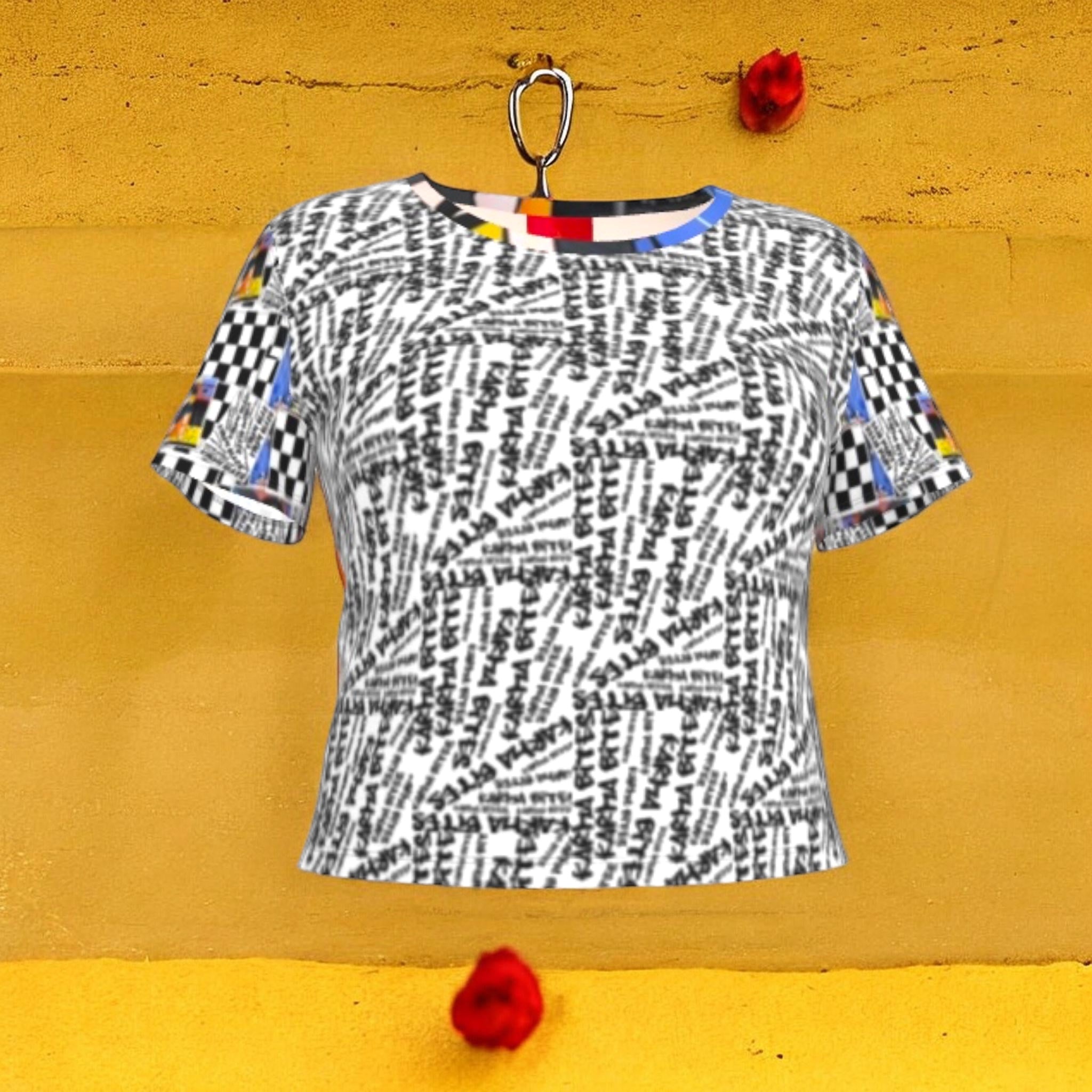 The Karma Bites Crop Tee — front view, all-over black & white Karma Bites graffiti script print with color-block neckline and Checkmate DNA Doll Wall collage sleeves — Vol III The Unbothered Edit by Golden Expression Art