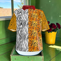 Front of 100% silk shirt with split zebra and tiger print, leopard short sleeves, and red collar