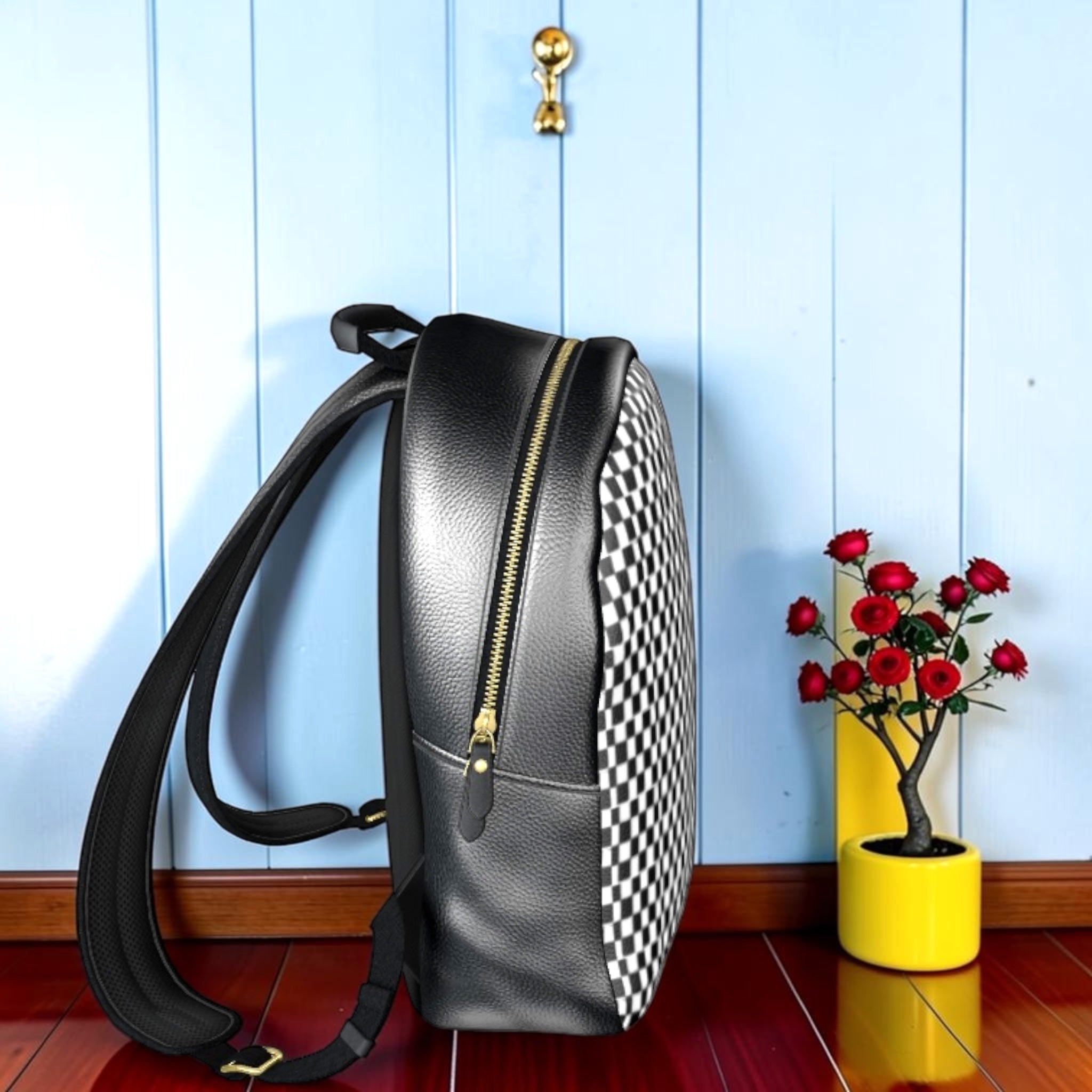 The Checkmate Carry Backpack — side view showing gold zipper and Checkmate DNA print panel | Golden Expression Art Vol III