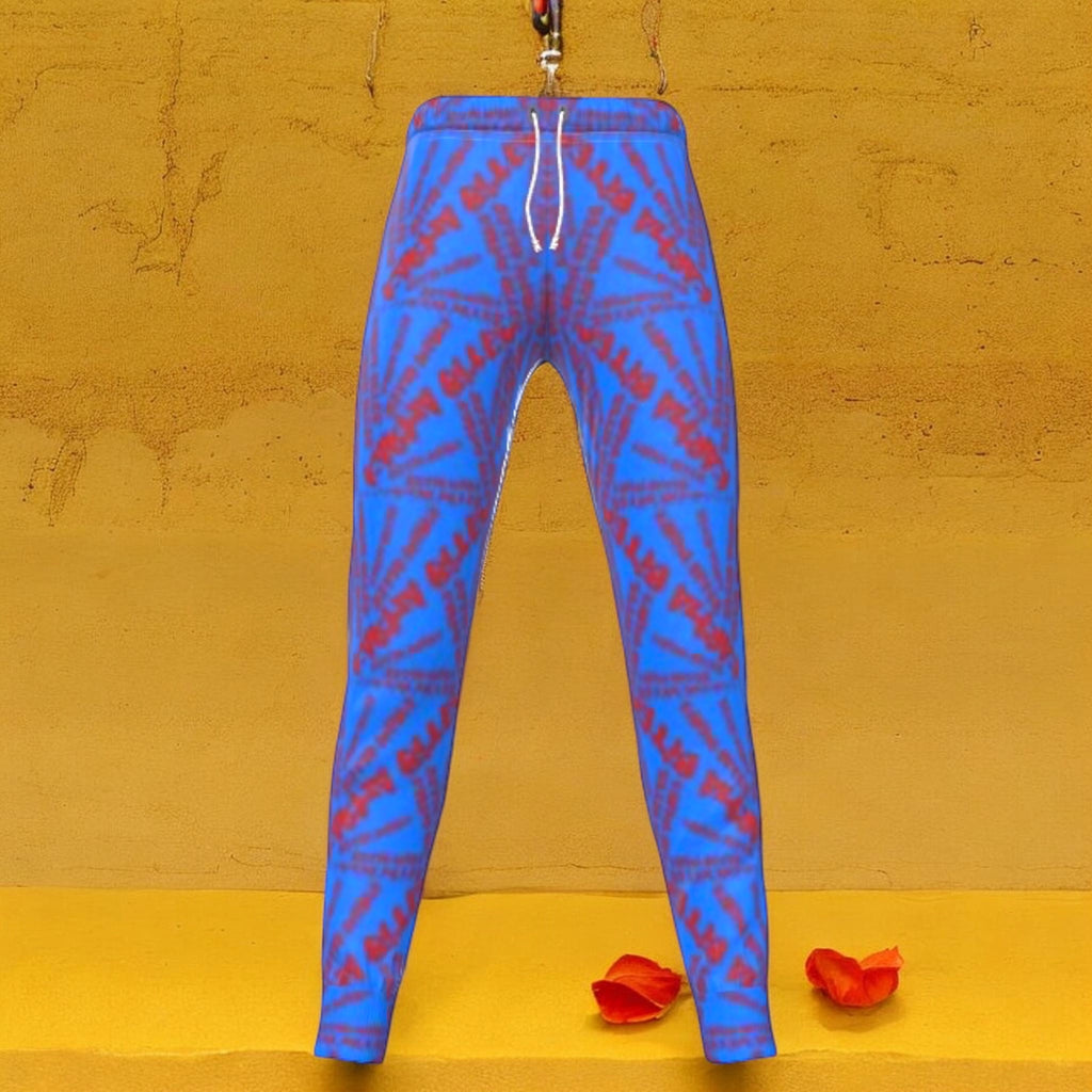 The Rox Jogger in cerulean blue with all-over scarlet red Karma Bites mirrored starburst print — Vol III The Unbothered Edit by Golden Expression Art