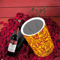 The ICONIC Mist Wine Cooler — golden yellow ICONIC all-over print with scarlet red lettering, styled with red roses and wine bottle