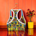 The Eden Empress Sports Bra — back racerback detail, all-over Doll Wall print, hanging on gold hanger