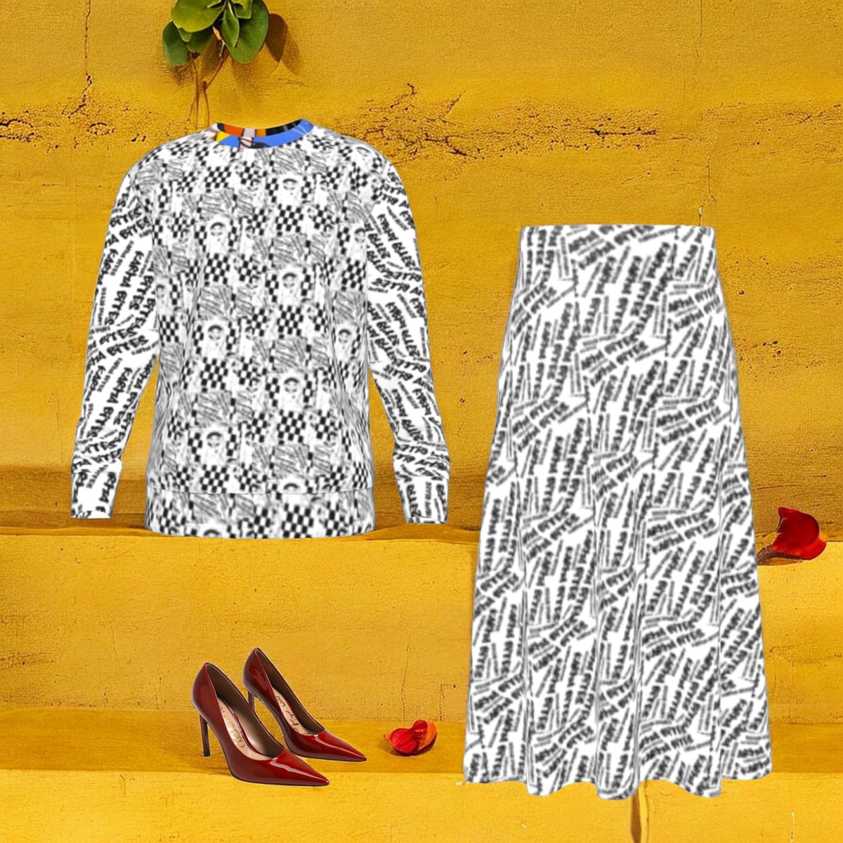The Double Take Sweatshirt styled with the coordinating graffiti-print skirt and red heels against a golden yellow backdrop