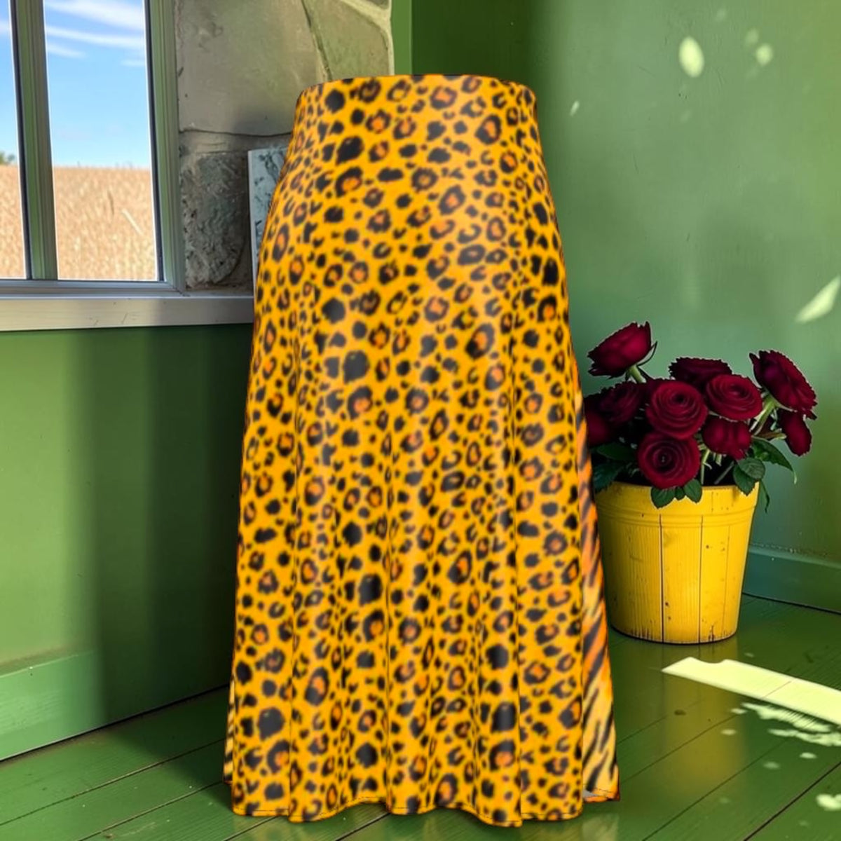 Wild Instinct silk midi skirt showing golden leopard-print panel and tiger-stripe side