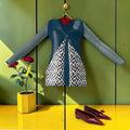 The Sovereign Top — teal silky jersey with black and white checkered front panel and red collar accent, front view