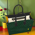 Vol I The Rule Carrier Large Tote — front view, forest green and black Checkmate DNA check body with cream pocket and gold zipper