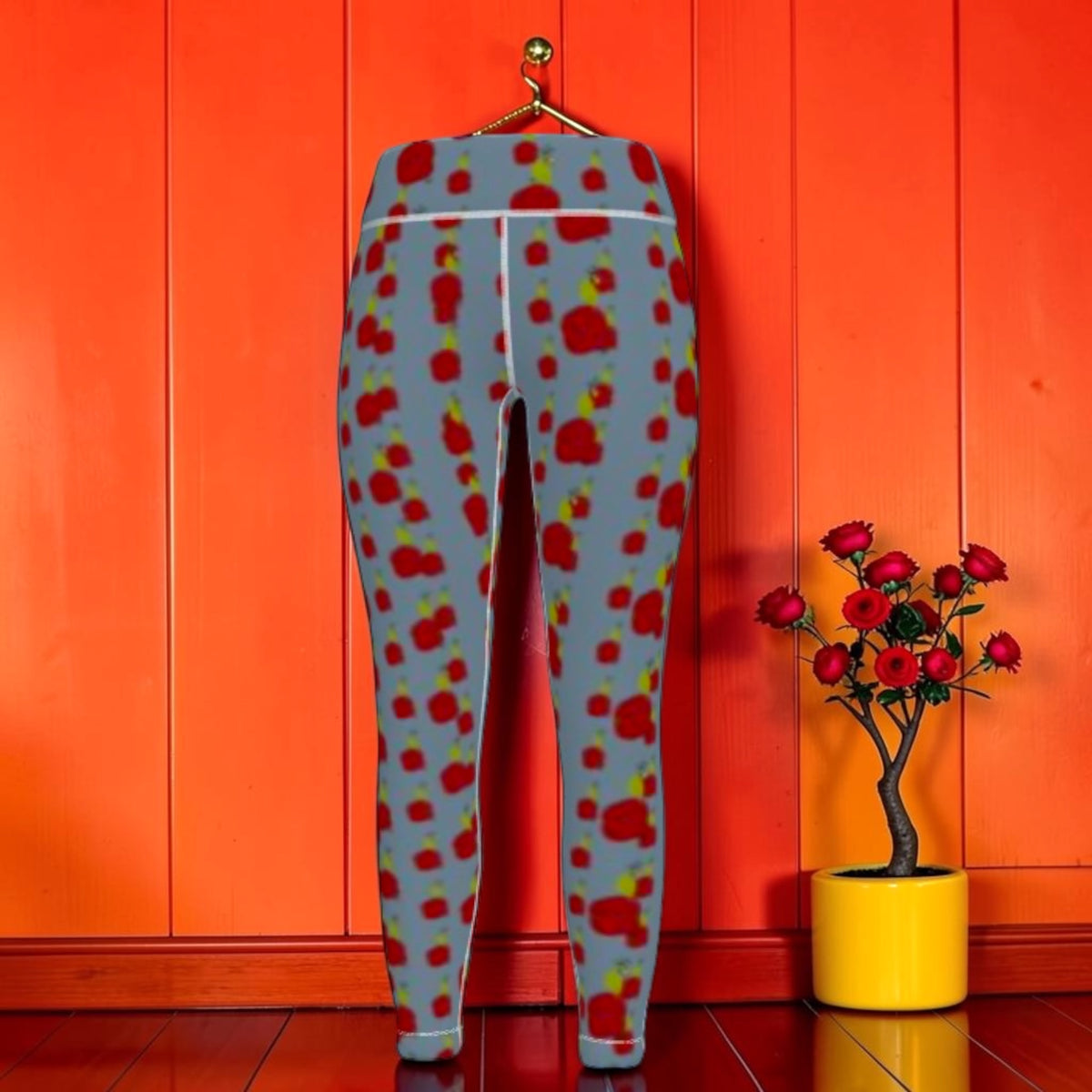 Buttercup Yoga Leggings back view with abstract scarlet and golden print on slate blue, styled with red rose floral arrangement — Golden Expression Art